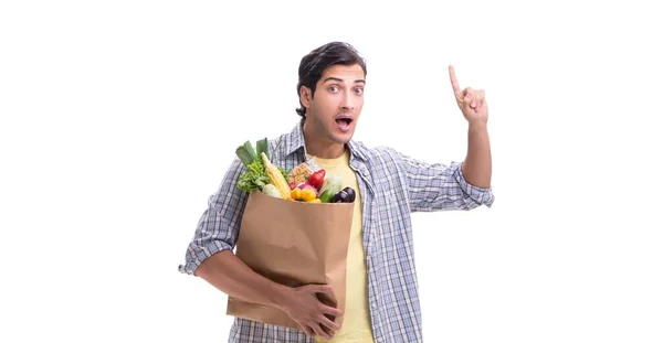 Joven con su tienda de comestibles en blanco —  Fotos de Stock