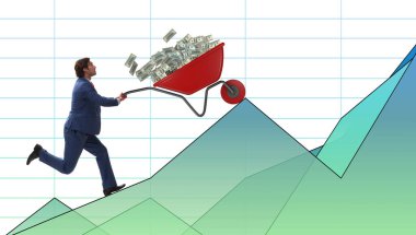 İş adamı, el arabası dolusu parayı itiyor.