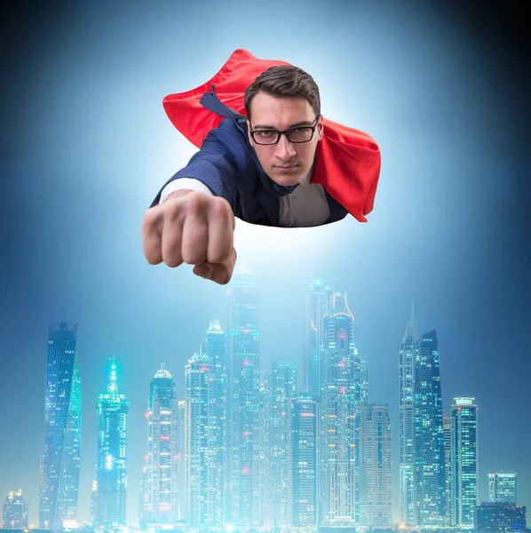 Superhéroe hombre de negocios volando sobre la ciudad —  Fotos de Stock