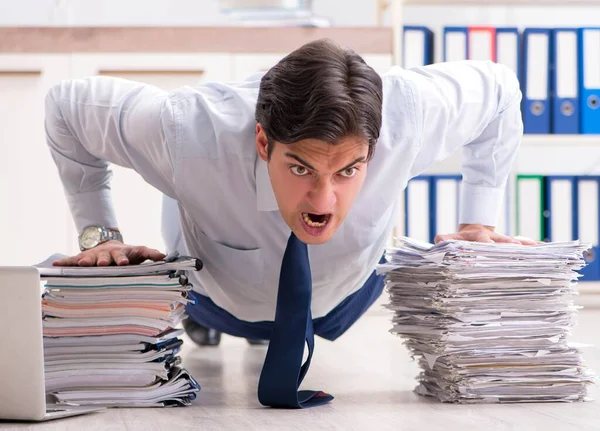 Extremely busy employee working in the office — Stock Photo, Image