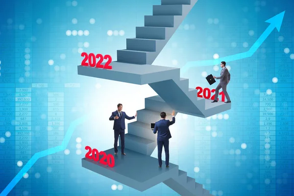 Businessman climbing stairs on yearly basis — Stock Photo, Image