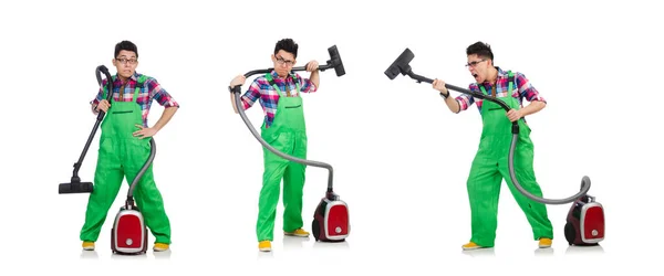 Funny man in green coveralls vacuum cleaning — Stock Photo, Image