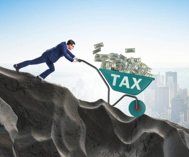 İşadamı, vergi parasıyla el arabası sürüyor.