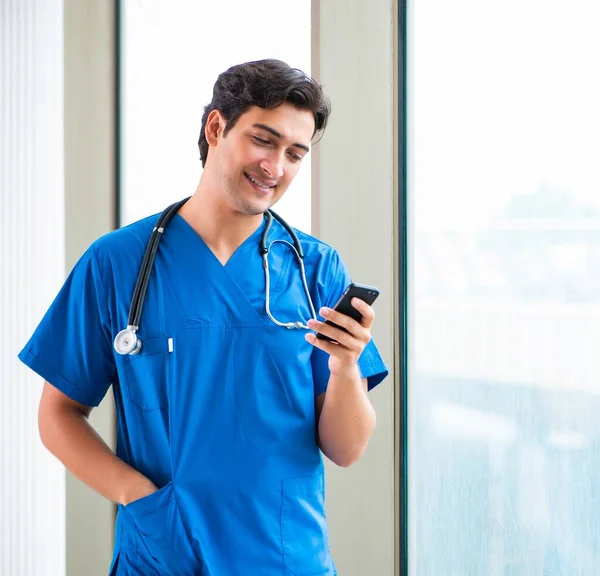 Young handsome doctor working in the hospital — Stock Photo, Image