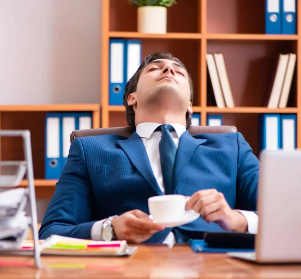 Young handsome businessman working in the office — Stock Photo, Image