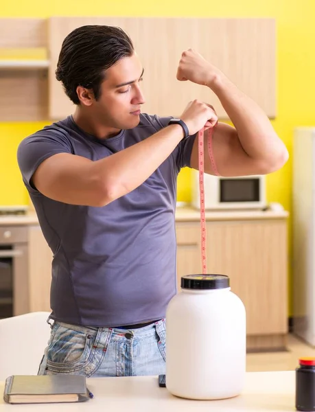 Young man blogging about food supplements — Stock Photo, Image