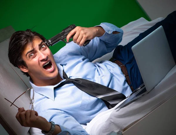 Young businessman under stress in the bedroom at night — Stock Photo, Image