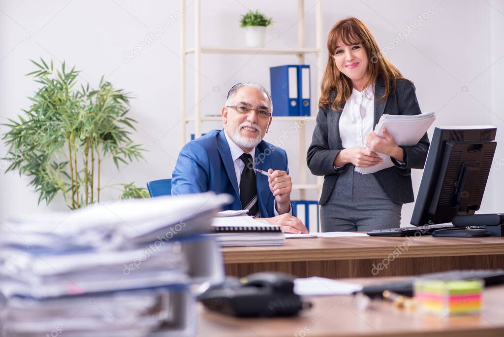 Two employees working in the office