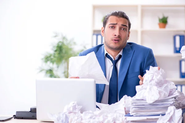 Businessman rejecting new ideas with lots of papers — Stock Photo, Image