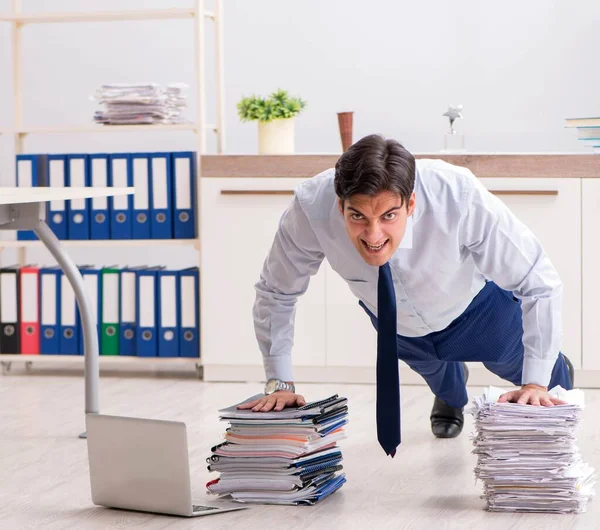 Extremely busy employee working in the office — Stock Photo, Image