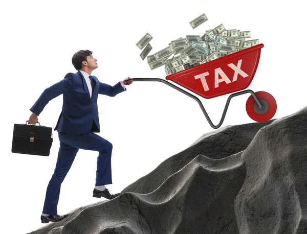 Businessman pushing tax wheelbarrow uphill — Stock Photo, Image