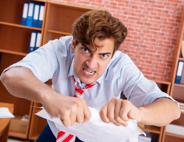 Unhappy businessman sitting in the office — Stock Photo, Image