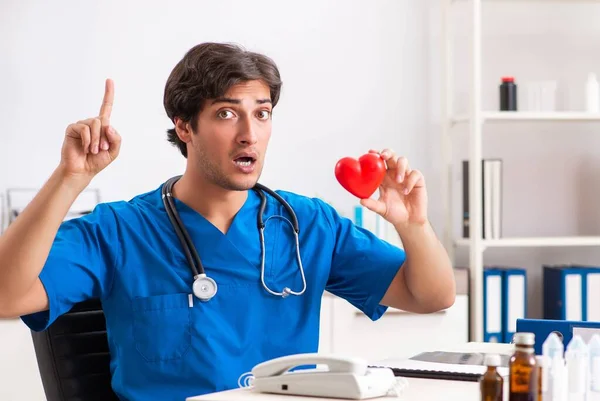 Young doctor in heart care concept — Stock Photo, Image