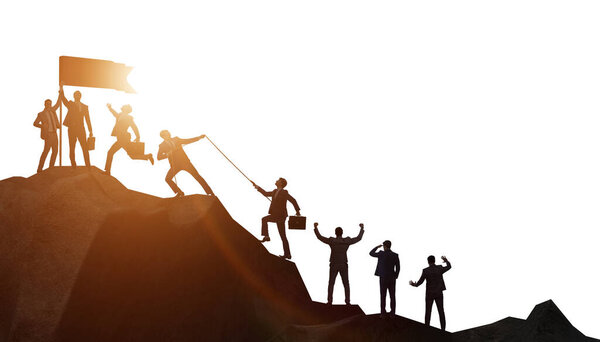 Concept of teamwork with team climbing mountain top