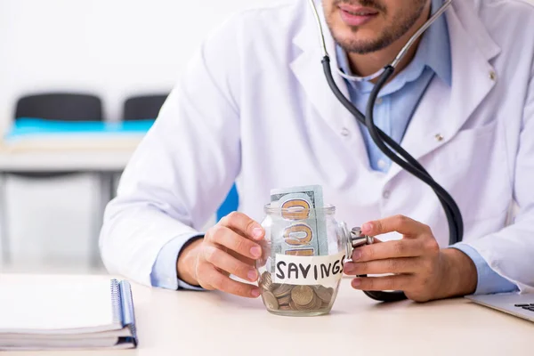 Young handsome male doctor working in the clinic — Stock Photo, Image