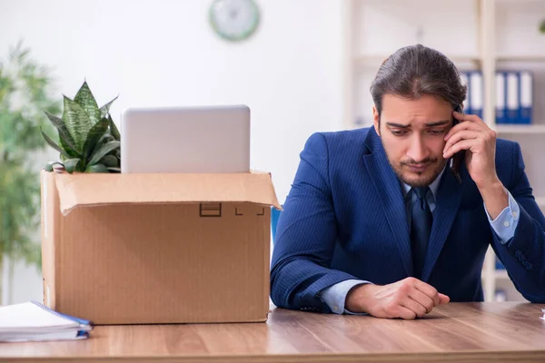 Young man being fired from his work