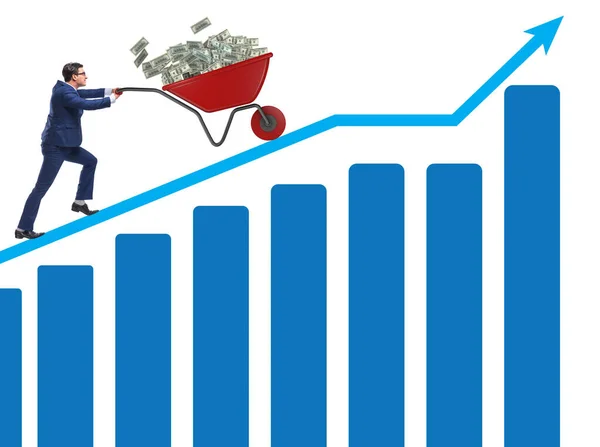 Empresário empurrando carrinho de mão cheio de dinheiro dólar — Fotografia de Stock