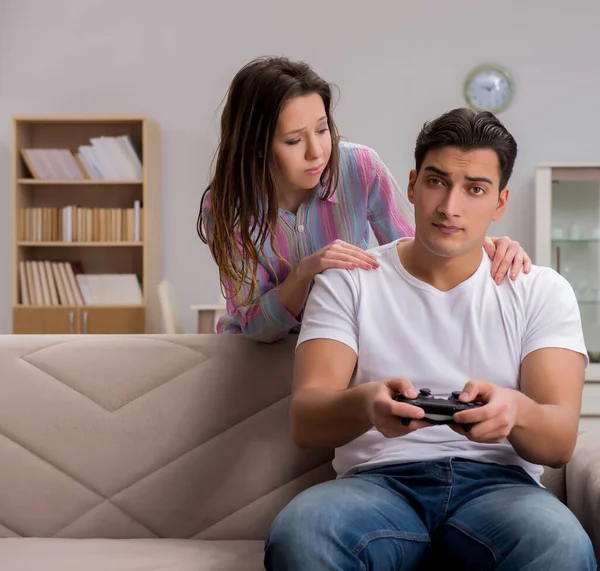 Young family suffering from computer games addiction — Stock Photo, Image