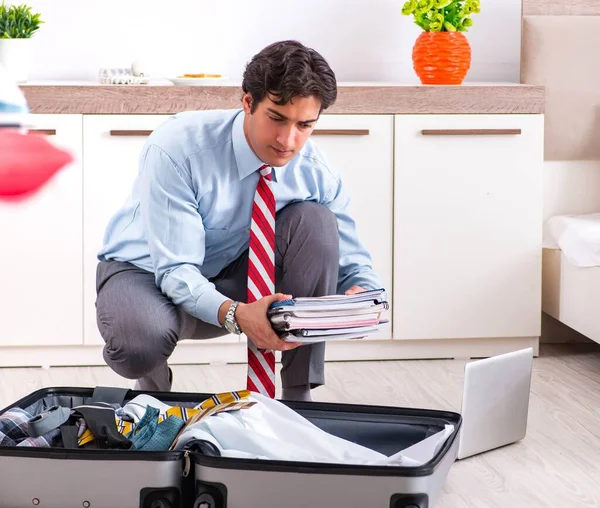 Young handsome businessman preparing for trip — Stock Photo, Image