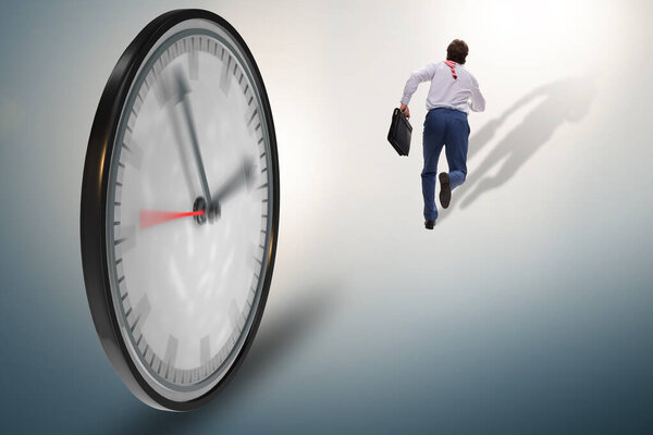 Businessman employee in time management concept