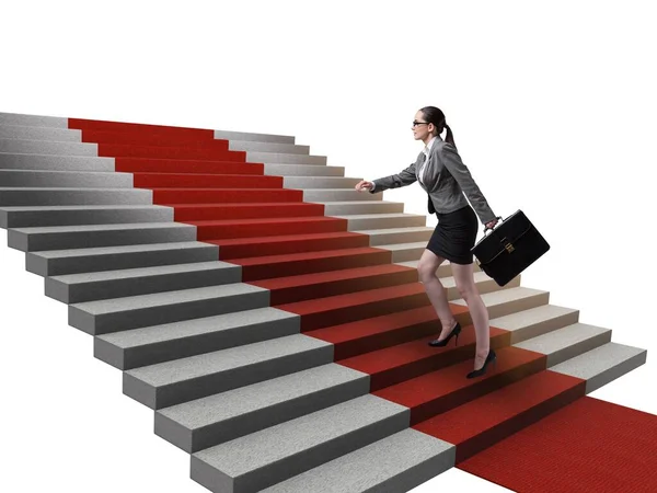 Joven empresaria subiendo escaleras y alfombra roja — Foto de Stock