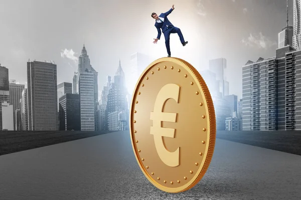 Businessman with giant golden euro coin — Stock Photo, Image