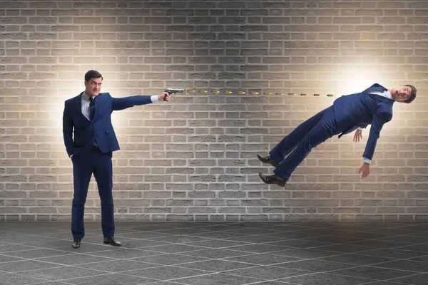 Businessman with gun threatening his competitor — Stock Photo, Image