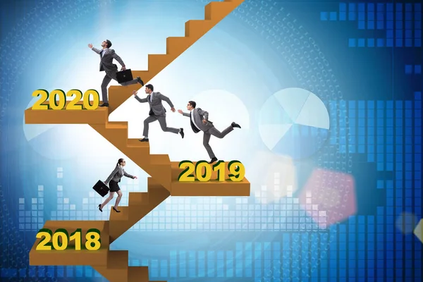 Businessman climbing stairs on yearly basis — Stock Photo, Image