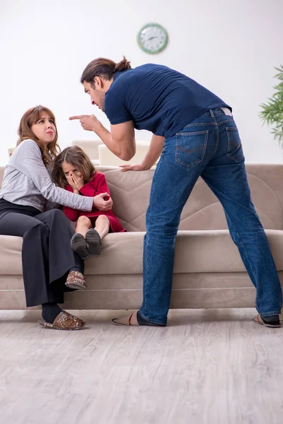 Young couple and their daughter in family conflict concept — Stock Photo, Image