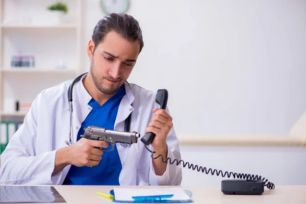 Young male doctor being tired after night shift — Stock Photo, Image