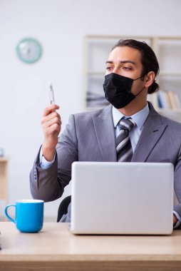 Young male employee in self-quarantine concept clipart