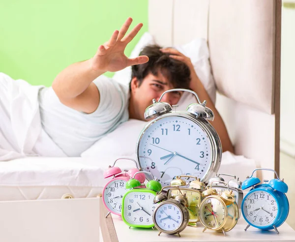 Young man having trouble waking up in early morning — Stock Photo, Image