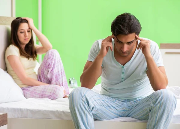 Woman and man in the bedroom after conflict — Stock Photo, Image