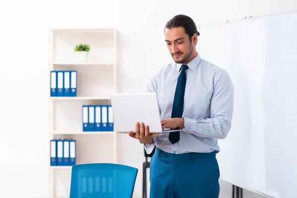 Young male employee in business presentation concept — Stockfoto