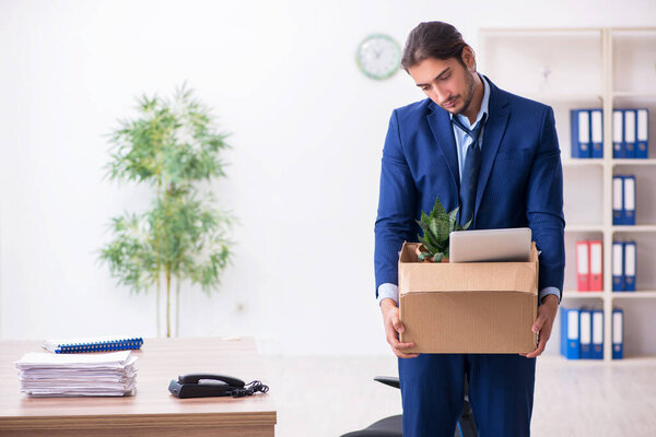 Young man being fired from his work