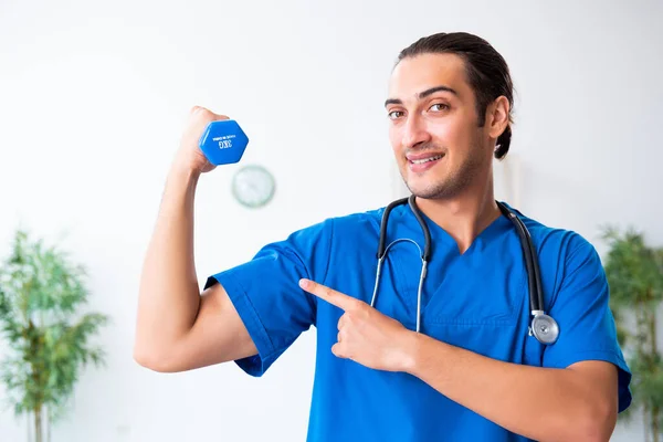 Young male doctor in sport and dieting concept — Stock Photo, Image