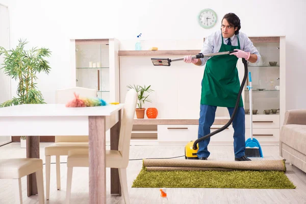 Young businessman cleaning the house — Stock Photo, Image