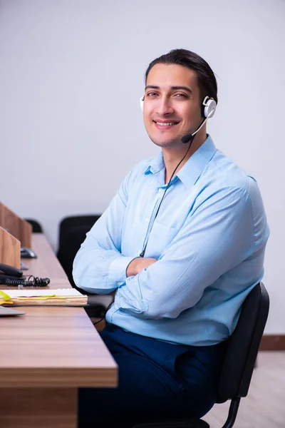 Call center operator working at his desk — Stock Photo, Image