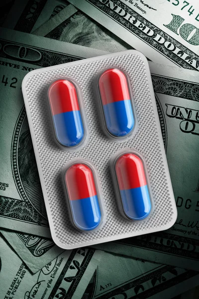 Red and blue pills in a blister on dollar bill background