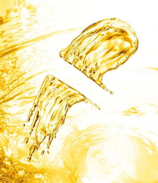 oil splash on gold bokeh background