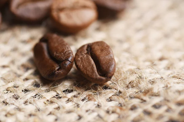 Roasted Coffee Beans Sackcloth Background — Free Stock Photo