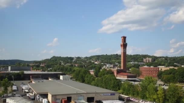 Tower with clock among trees — Stock Video