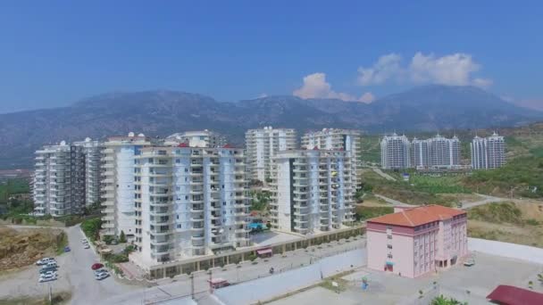 Residential complex and Azura Park hotel against mountains — Stock Video