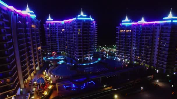 Hotel Azura Park with changing colourful illumination at night — Stock Video