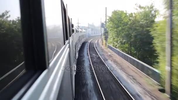 Modern double-decker train travels on rails — Stock Video