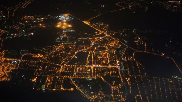 Landscape with settlements and roads through porthole of airplane — Stock Video