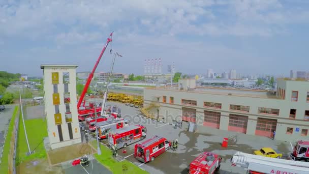 Fire station with firemen and special transport — Stock Video