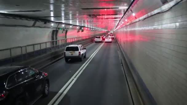 Many cars move in long tunnel — Stock Video