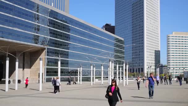 People walk near building Les Collines de lArche — Stock Video