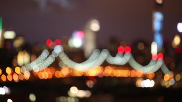 Illuminated suspension bridge in modern city — Stock Video